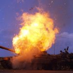 A tank belonging to forces loyal to Libyan leader Gaddafi explodes after being hit