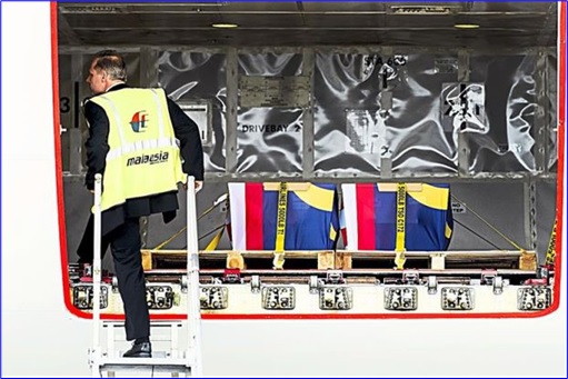 Malaysian Flight MH17 Victims Return Home - MAS staff check coffins