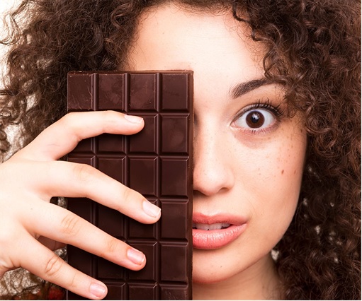 Girl Holding Huge Bar of Chocolate