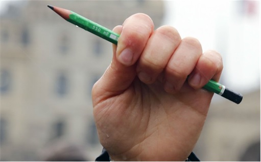 Charlie Hebdo - Holding a pencil