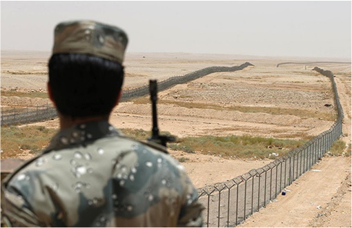 Saudi Arabia Soldier Watching Fence Border