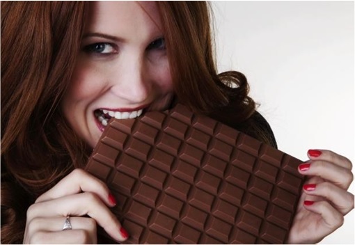 Woman Eating A Huge Bar of Chocolate
