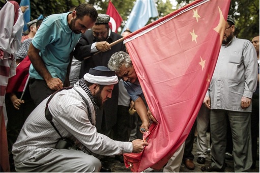 Turks Uyghurs Burning China Flag