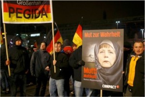 Syrian Refugee Protest by PEGIDA - Chancellor Merkel Wears Hijab