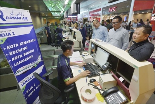 Rayani Air - Customers Check In At Counter