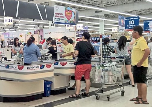 Shoppers Queuing at Tesco