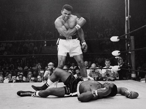 Muhammad Ali Quote - Impossible is just a big word thrown around by small men who find it easier to live in the world they've been given than to explore the power they have to change it