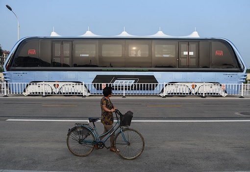 China Transit Elevated Bus TEU - Cyclist Looking at TEU