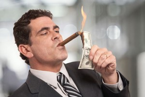capitalism-and-globalism-burning-dollar-note-on-cigar