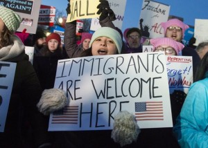 President Donald Trump Bans Muslims From Seven Countries - Protesters with Banner