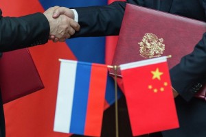 China-Russia Alliance - Handshake and Flags