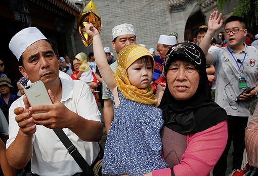 Uighur Muslim Family with Daughter in Xinjiang