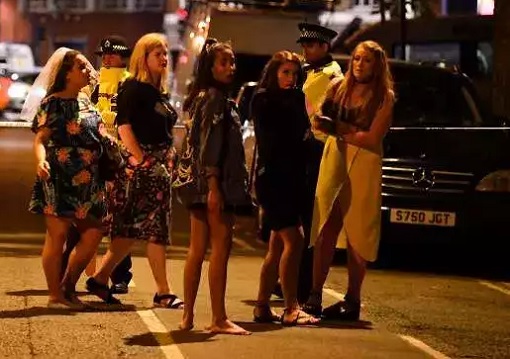 London Bridge and Borough Market Terror Attack - Women Stand at a Police Cordon