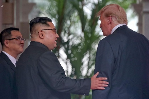 Donald Trump Meets Kim Jong-Un - Kim Holds Trump's Arm