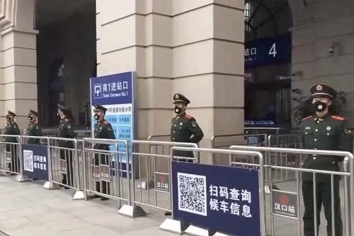 Coronavirus - Wuhan Lockdown - Police Guard