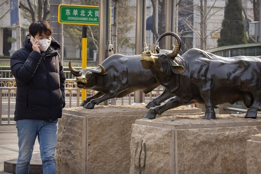China Stock Market - Young People Passing A Bull Statue