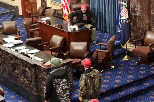 US Capitol Riot Photo - Protesters Take Control Of The Senate Chamber