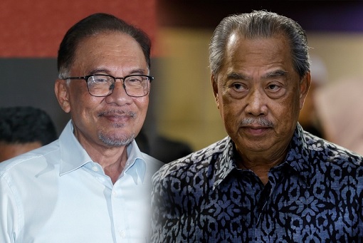 Anwar Ibrahim Smiling and Muhyddin Yassin Sad
