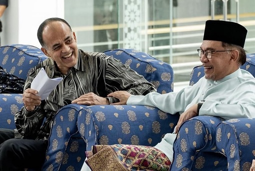 Prime Minister Anwar Ibrahim and Billionaire Syed Mokhtar - Laughing