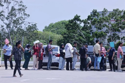 Job Seekers Queuing - Production Operators and Technicians by Germany’s Infineon Technologies AG